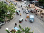 Motorbike traffice in a busy Phnom Penh interesection seen from high above..